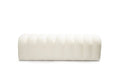 White boucle upholstered bench with vertical tufting on a white background.