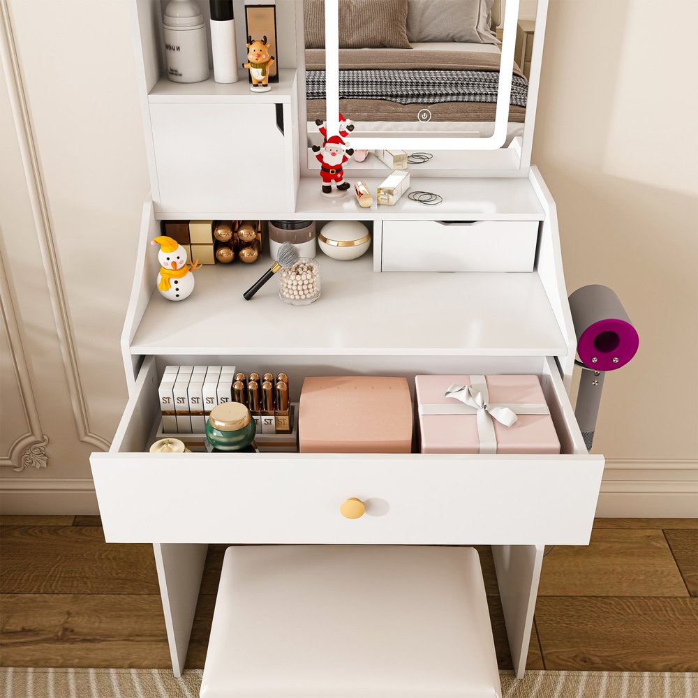 White wood vanity table with a lighted mirror, three drawers, and a stool, with a hairdryer attached to the side.