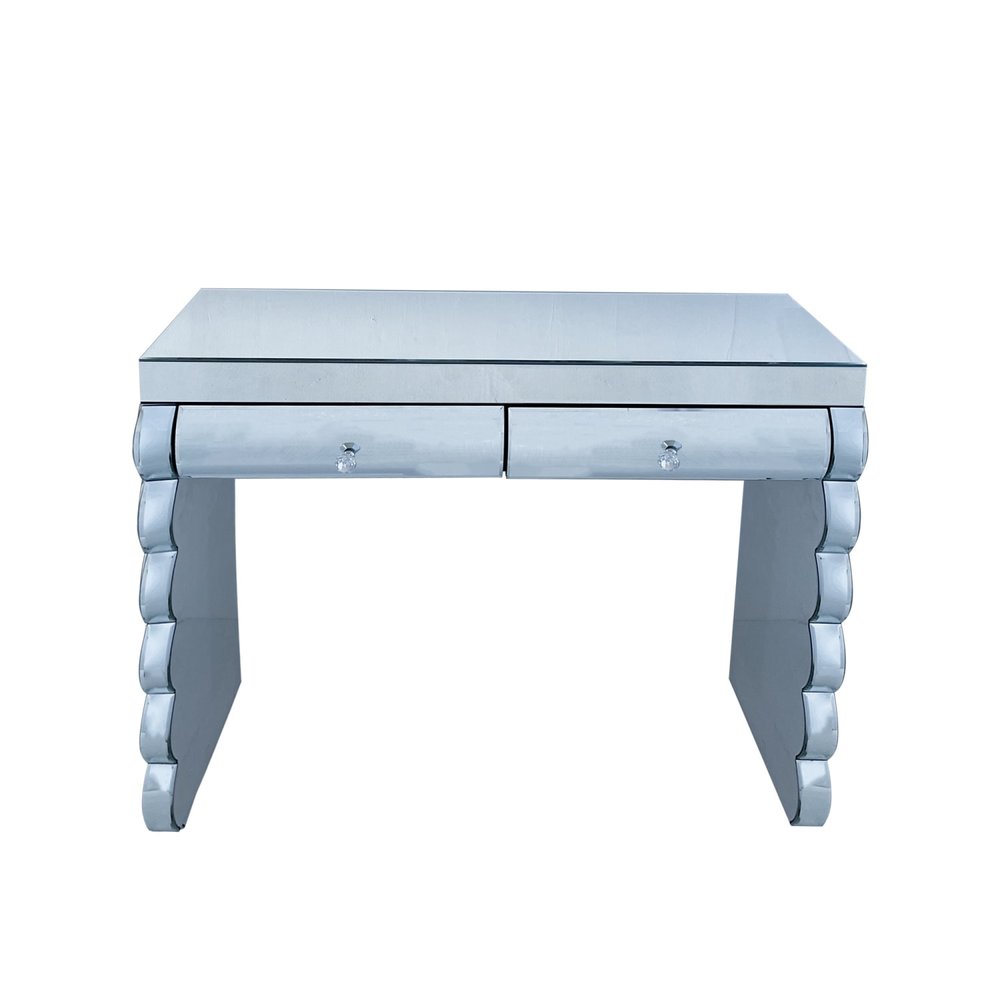 Mirrored vanity table with two drawers and crystal knobs on a white background.