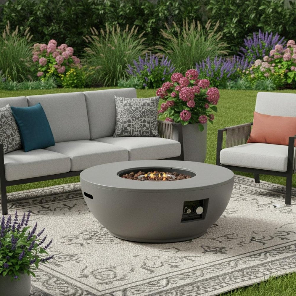 50000 BTU 36" Gray Steel Propane Round Fire Pit With Cover shown outdoors on a tiled patio with greenery.