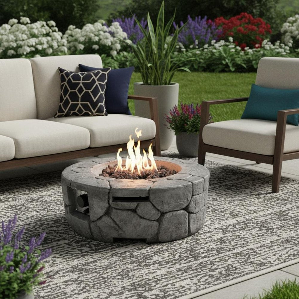40000 BTU 28" Gray Steel Propane Round Fire Pit With Cover shown outdoors on a tiled patio with greenery.