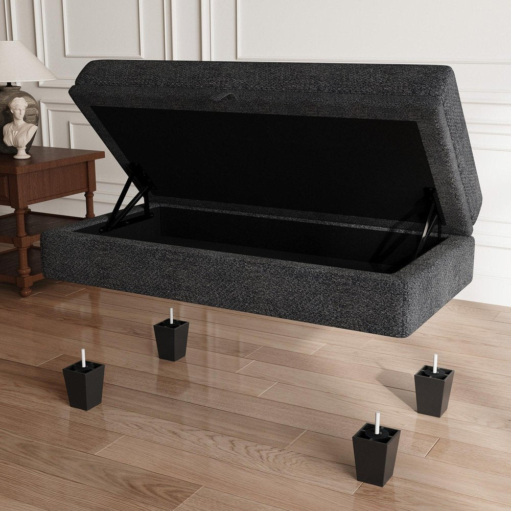 46" Beige And Black Chenille Ottoman With Storage styled in a furnished interior with an off-white wall on a wood floor.