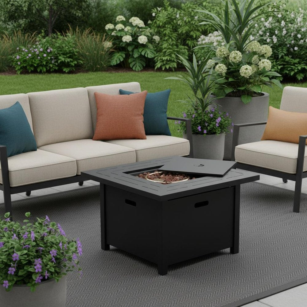 50000 BTU 28" Black Rattan Propane Square Fire Pit With Cover shown outdoors on a tiled patio with greenery.