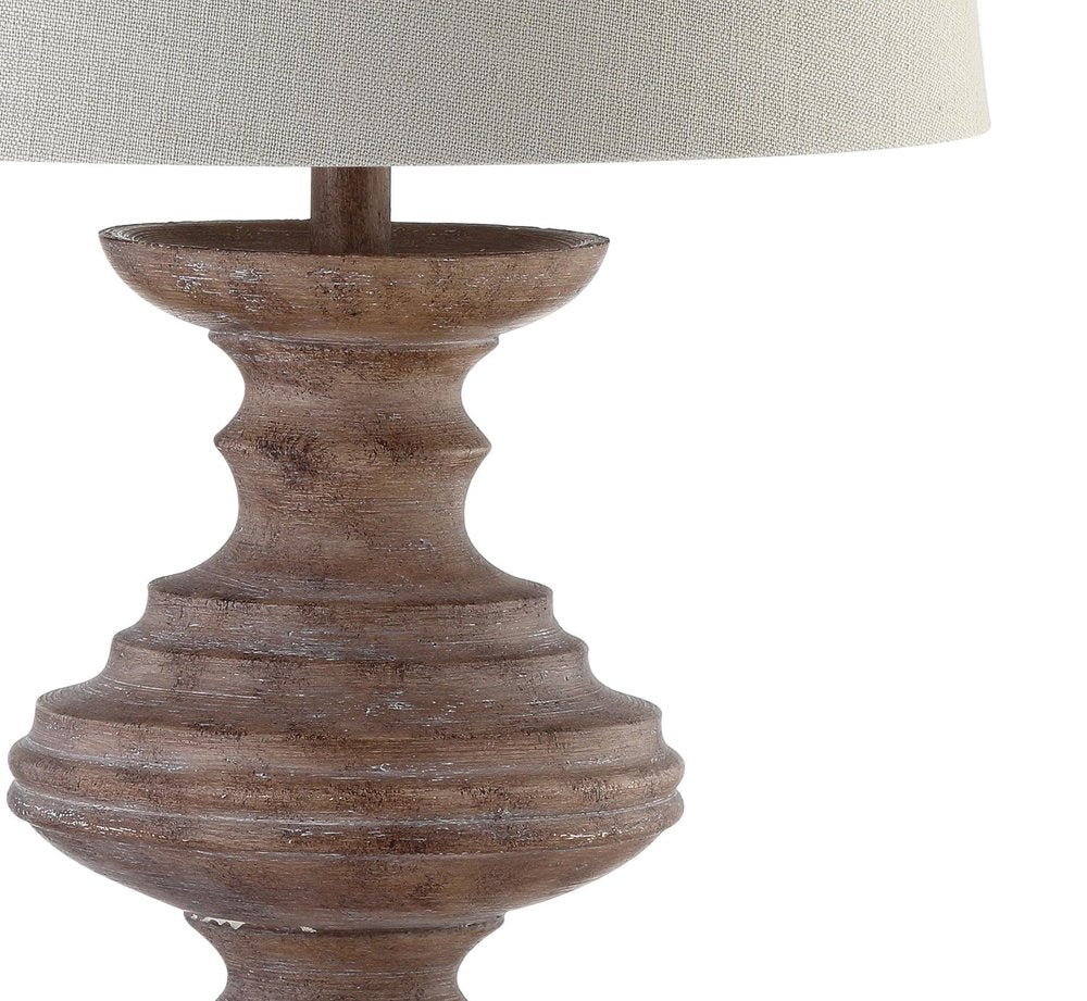 27" Brown Urn Bedside Lamp With Drum Shade. Lamp isolated on a plain white background, showing its brown color.