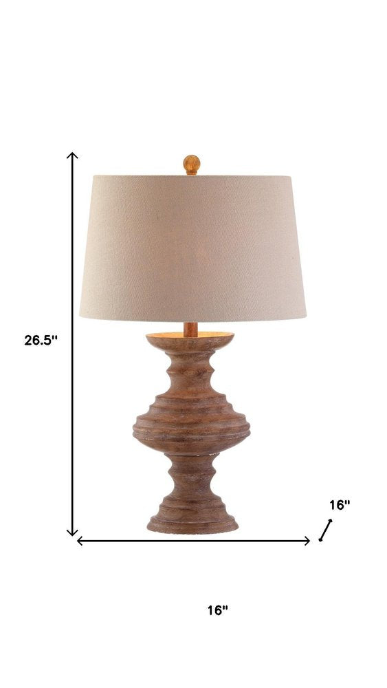 27" Brown Urn Bedside Lamp With Drum Shade. Lamp isolated on a plain white background, showing its brown color.
