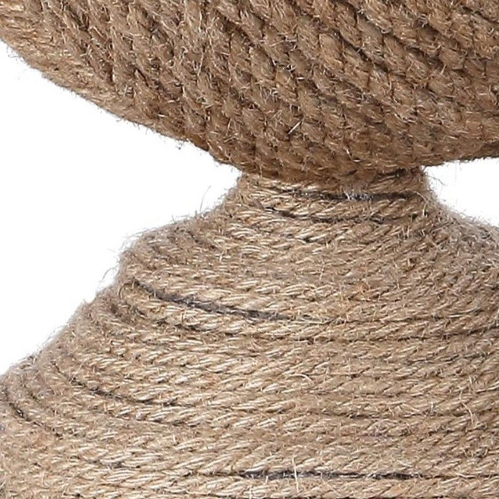 Cropped view of 24" Brown Globe Table Lamp With Drum Shade focusing on the brown surface.