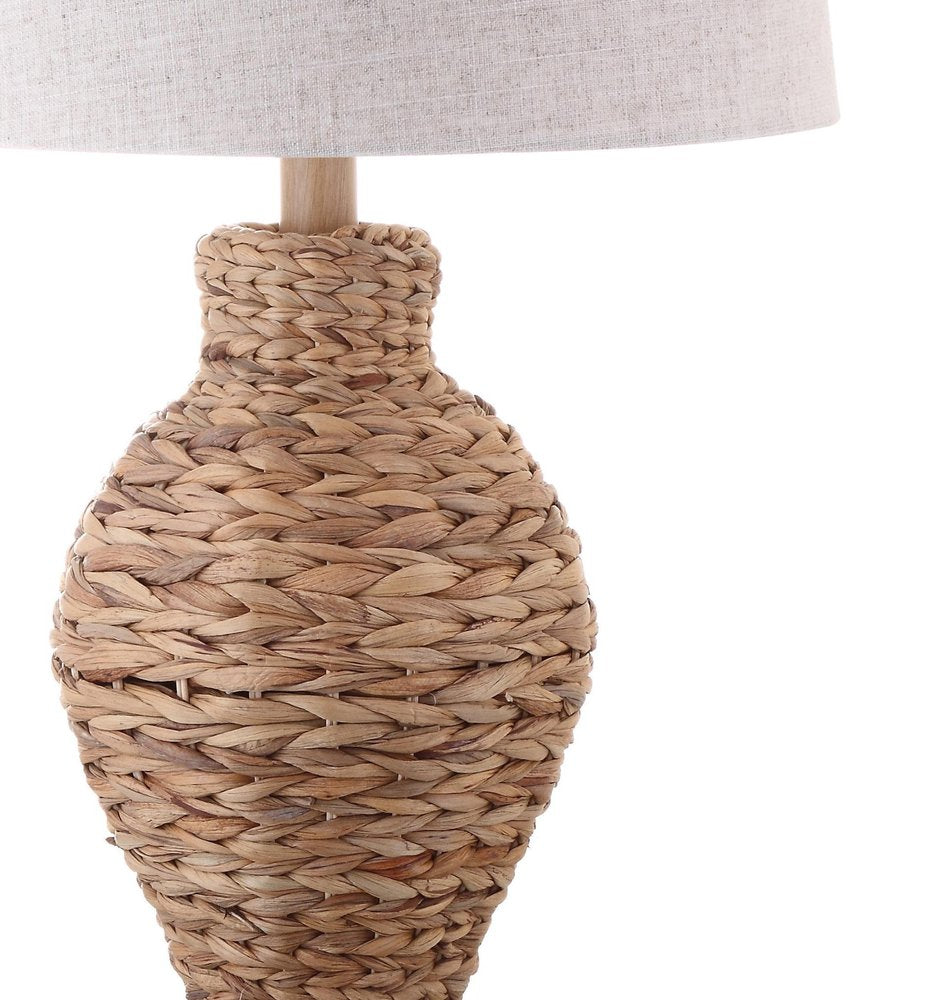 31" Natural Water Hyacinth Urn Table Lamp With Drum Shade. Table lamp isolated on a plain white background, in a tan finish.