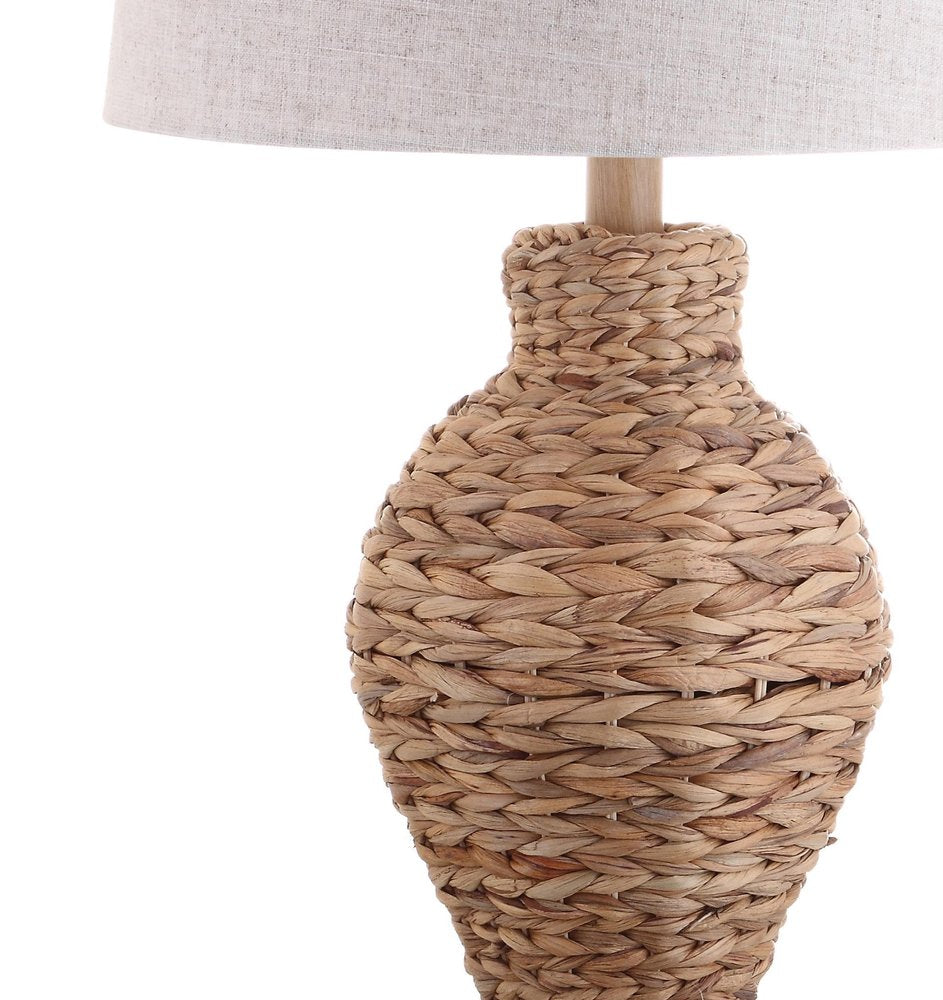 31" Natural Water Hyacinth Urn Table Lamp With Drum Shade. Table lamp isolated on a plain white background, finished in tan.