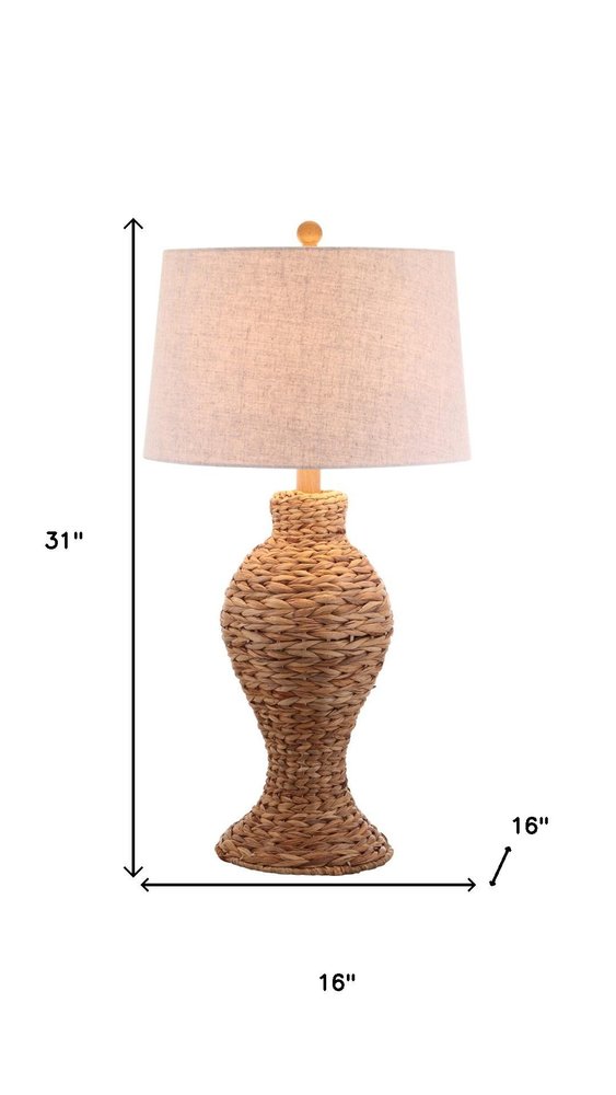 31" Natural Water Hyacinth Urn Table Lamp With Drum Shade. Table lamp isolated on a plain white background, finished in tan.