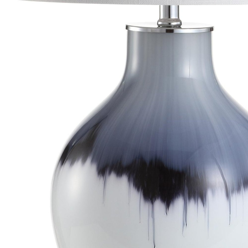 27" Silver Novelty Table Lamp With Globe Shade. Table lamp isolated on a plain white background, in a silver finish.