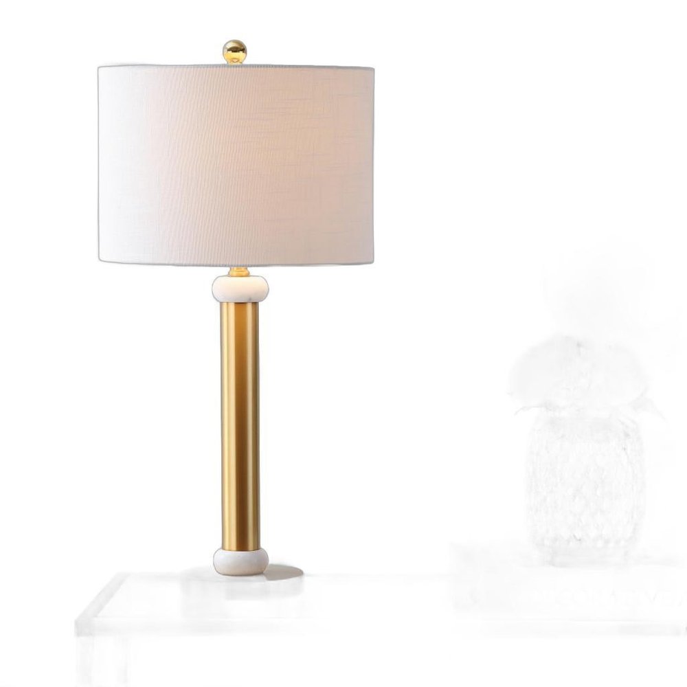 27" Gold Novelty Table Lamp With Drum Shade. Table lamp isolated on a plain white background.
