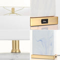 Set of Two 25" Gold Table Lamps With Shades on a white background