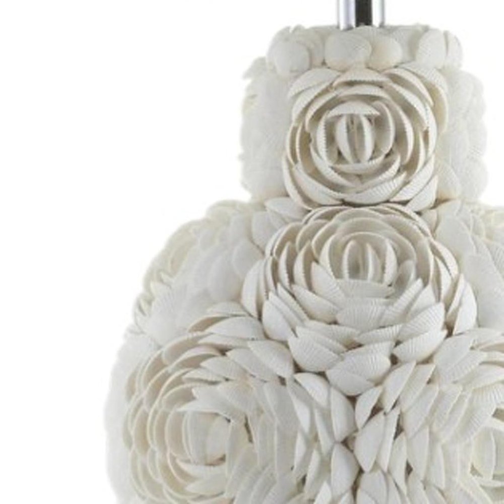 24" Off White Seashell Table Lamp With White Drum Shade. Table lamp isolated on a plain white background, finished in off-white.