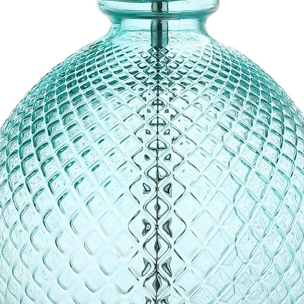 Cropped view of 26" Clear Novelty Table Lamp With Drum Shade focusing on the surface surface.