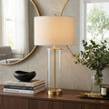 29" Gold Table Lamp With Drum Shade. Table lamp in gold.