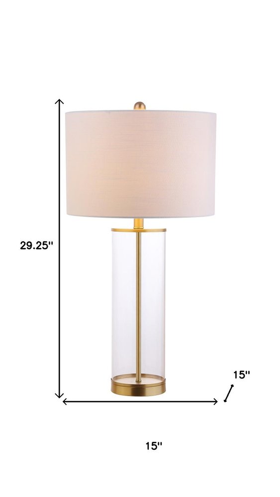 29" Gold Table Lamp With Drum Shade. Table lamp isolated on a plain white background.