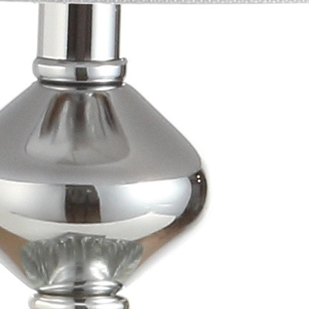 28" Silver Table Lamp With Drum Shade. Table lamp isolated on a plain white background, finished in silver.