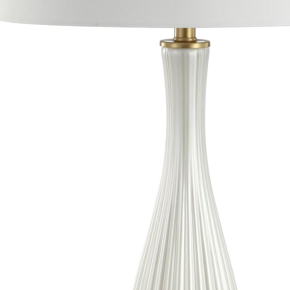 34" Gold Novelty Table Lamp With Globe Shade. Table lamp isolated on a plain white background, finished in gold.