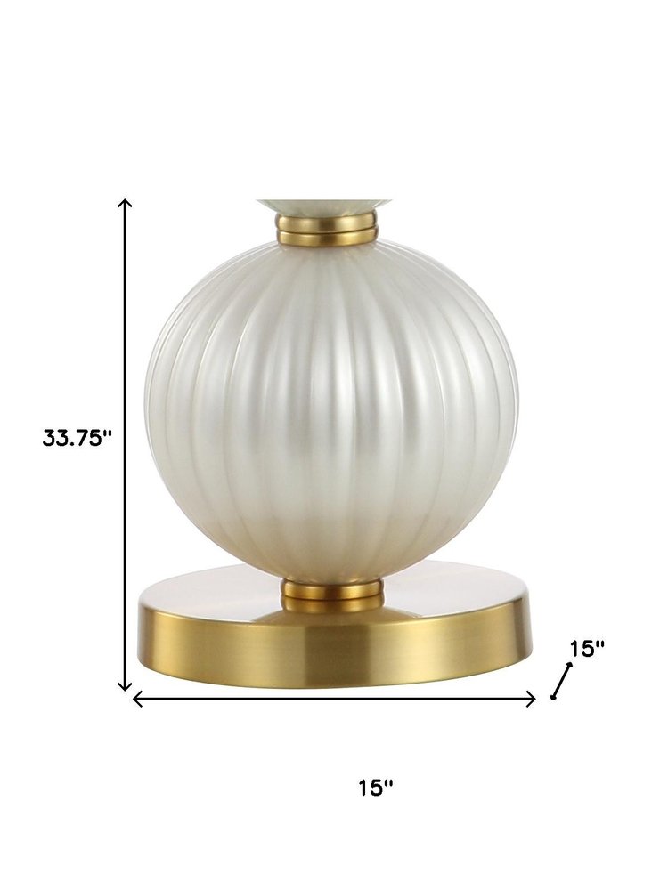 34" Gold Novelty Table Lamp With Globe Shade. Table lamp isolated on a plain white background, showing its gold color.