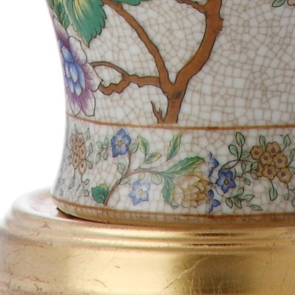 Close-up of 24" Gold And Off White Urn Table Lamp With Empire Shade showing off-white detail.