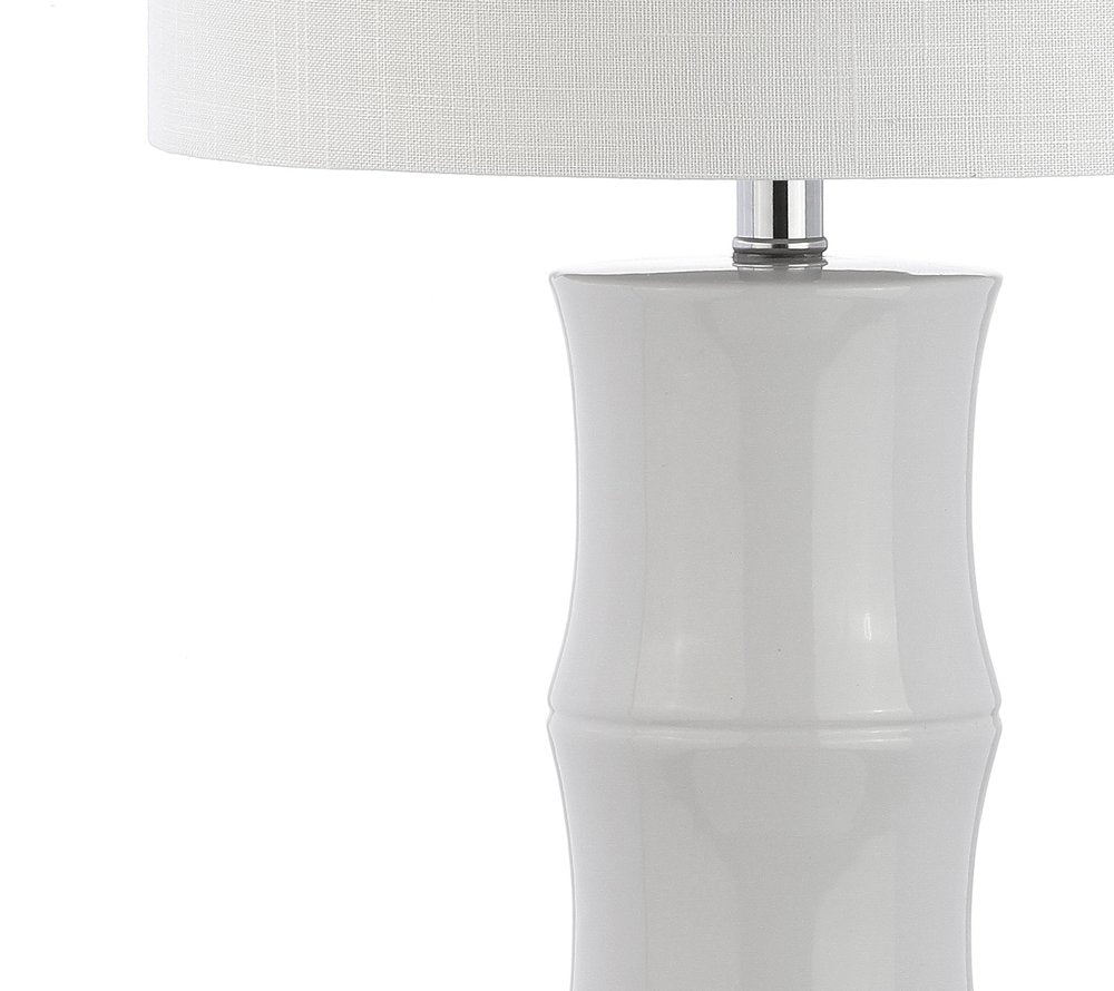 27" Clear Table Lamp With Drum Shade. Table lamp isolated on a plain white background, in a clear finish.