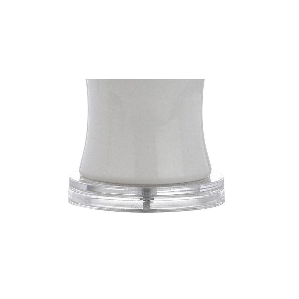 27" Clear Table Lamp With Drum Shade. Table lamp isolated on a plain white background, showing its clear color.