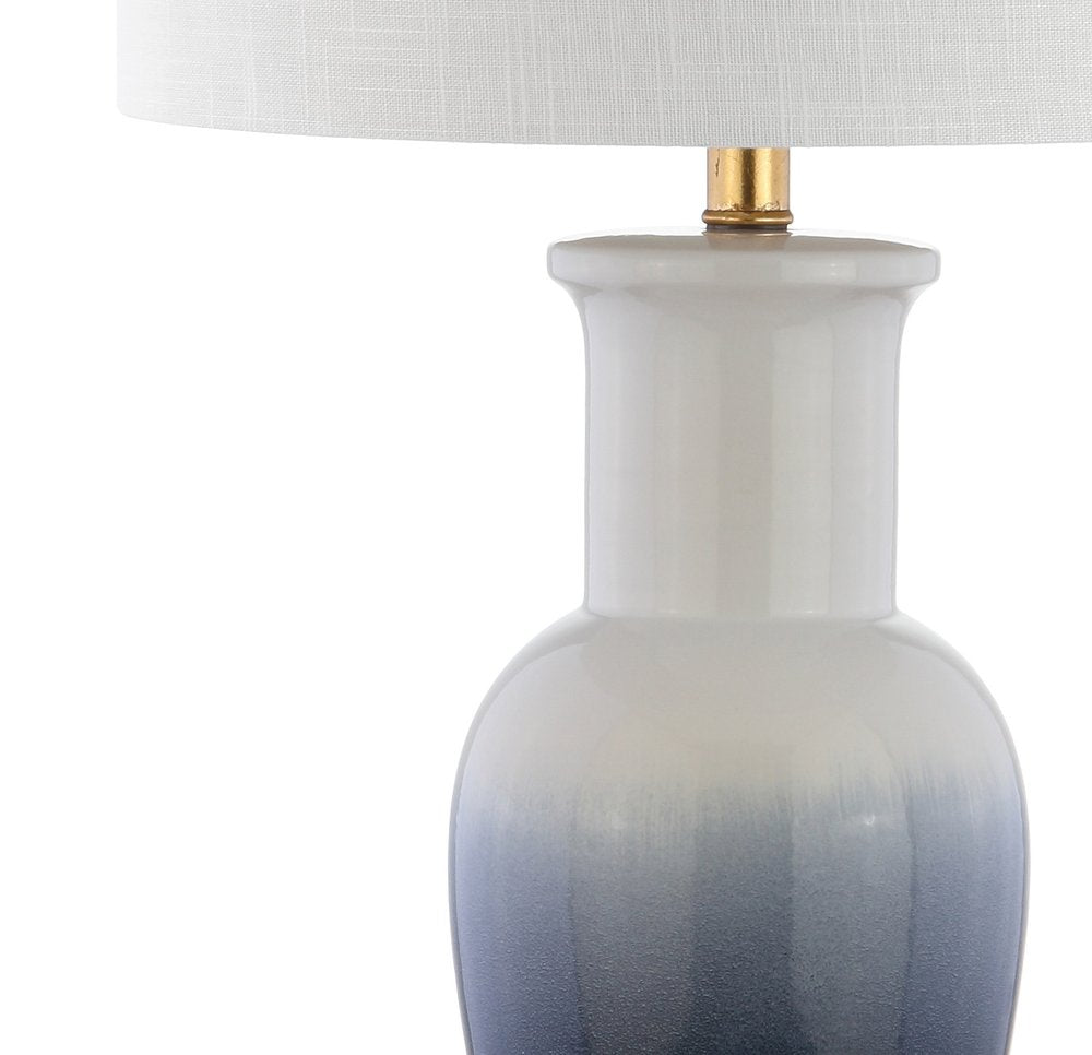 32" Gold Novelty Table Lamp With Drum Shade. Table lamp isolated on a plain white background.