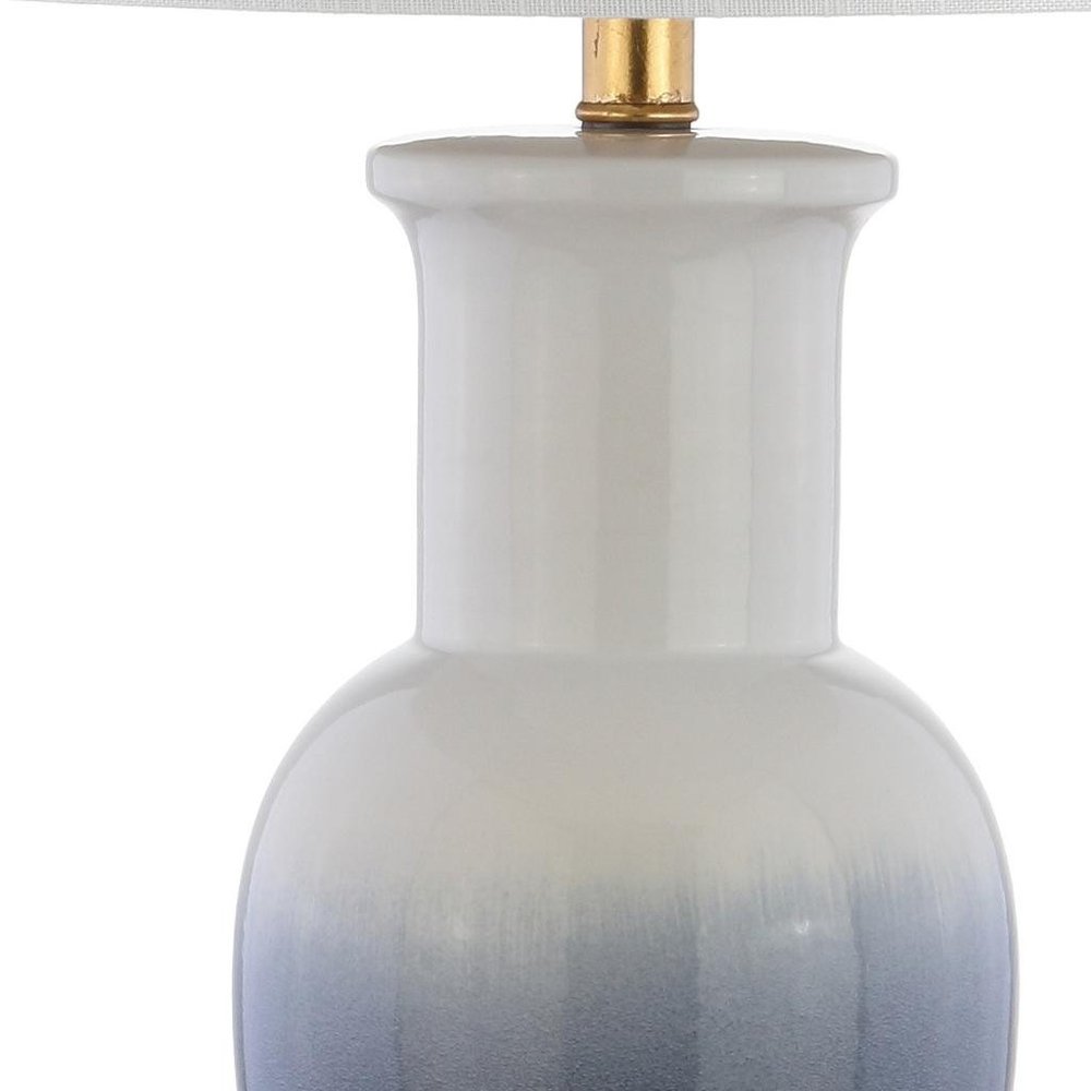 32" Gold Novelty Table Lamp With Drum Shade. Table lamp isolated on a plain white background.