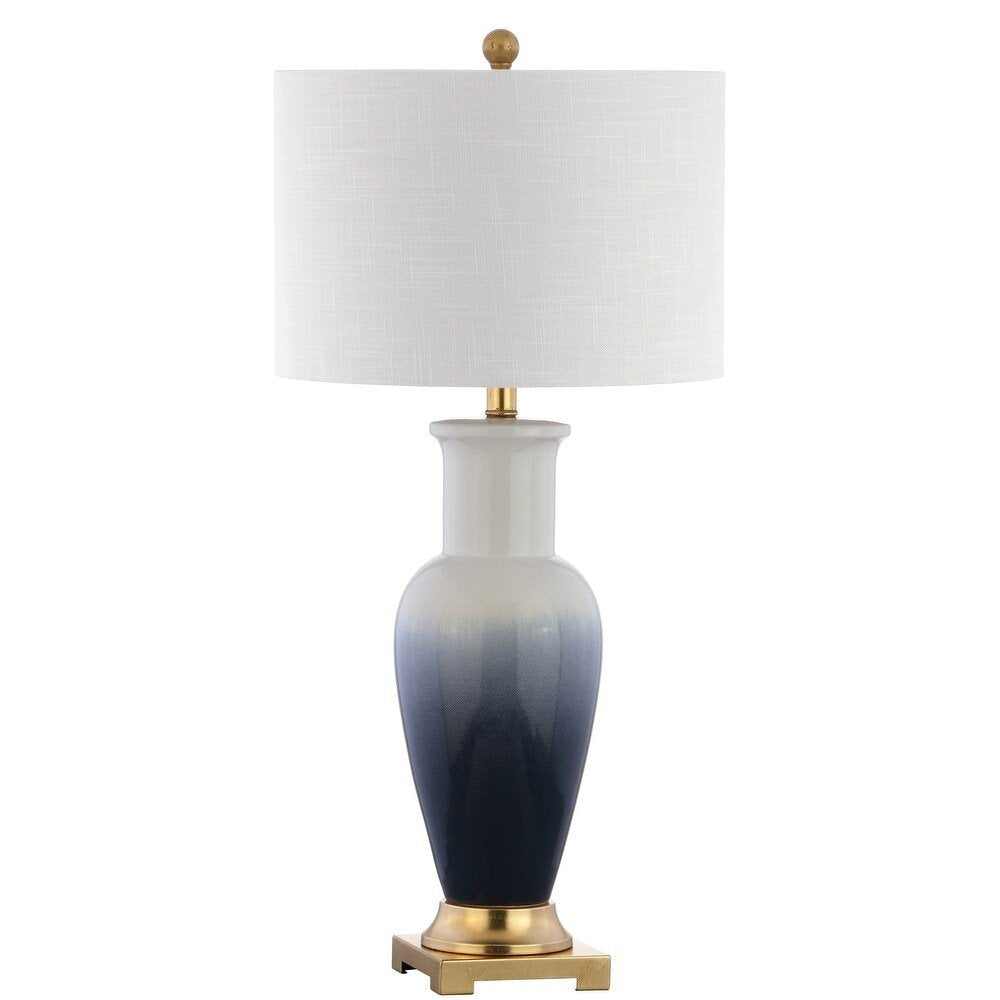 32" Gold Novelty Table Lamp With Drum Shade. Table lamp isolated on a plain white background.