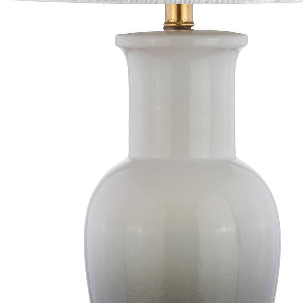 32" Gold Novelty Table Lamp With Drum Shade. Table lamp isolated on a plain white background.
