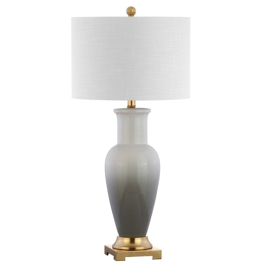 32" Gold Novelty Table Lamp With Drum Shade. Table lamp isolated on a plain white background.