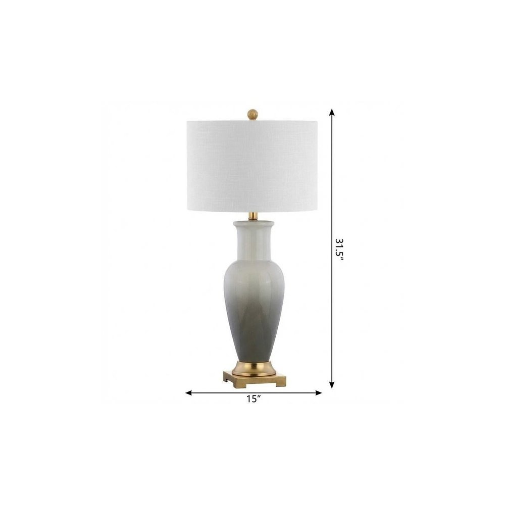 32" Gold Novelty Table Lamp With Drum Shade. Table lamp isolated on a plain white background.