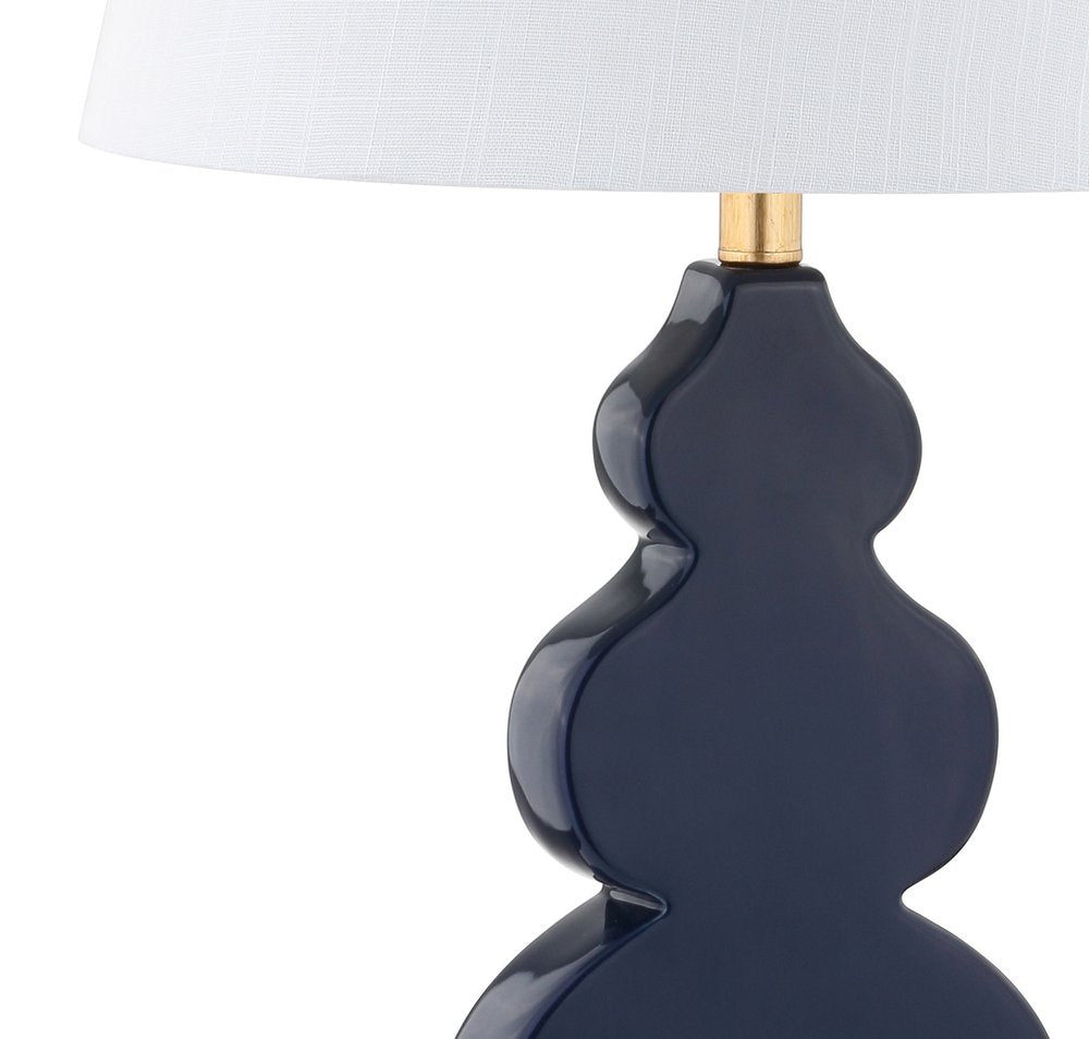 29" Gold Novelty Table Lamp With Drum Shade. Table lamp isolated on a plain white background.