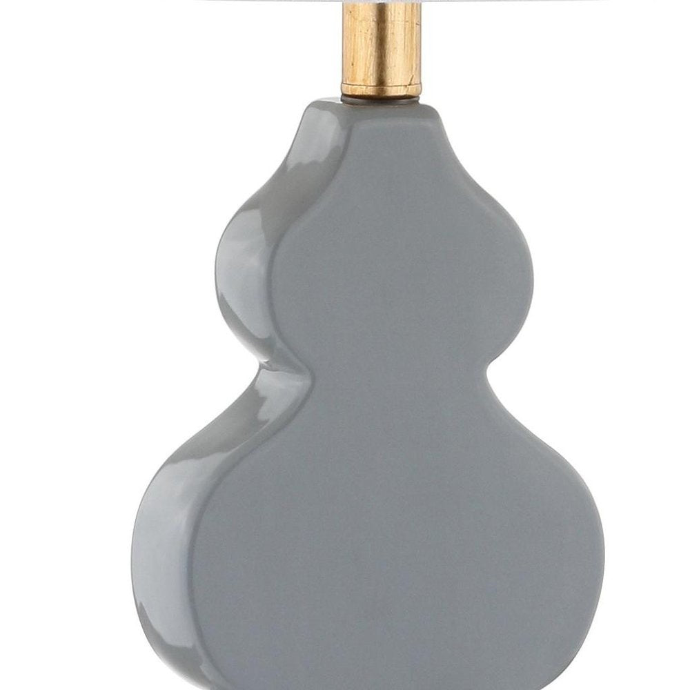 29" Gold Novelty Table Lamp With Drum Shade. Table lamp isolated on a plain white background.