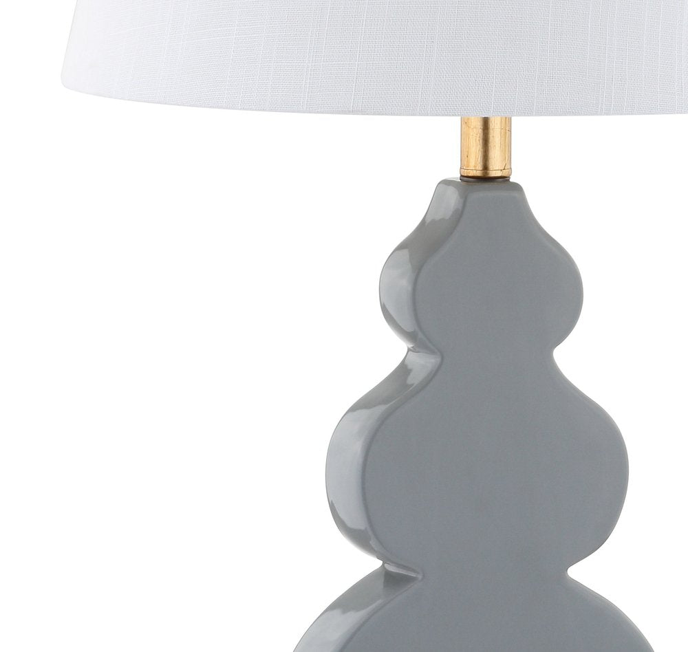 29" Gold Novelty Table Lamp With Drum Shade. Table lamp isolated on a plain white background.