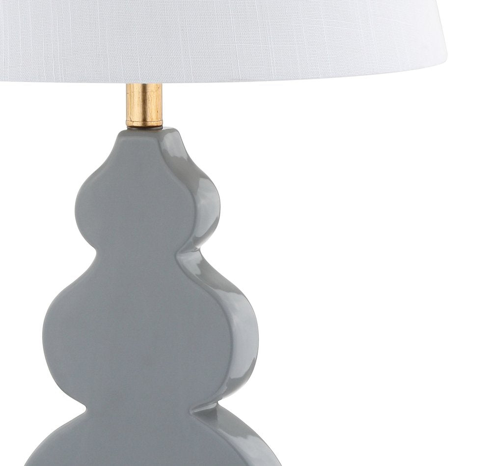 29" Gold Novelty Table Lamp With Drum Shade. Table lamp isolated on a plain white background.