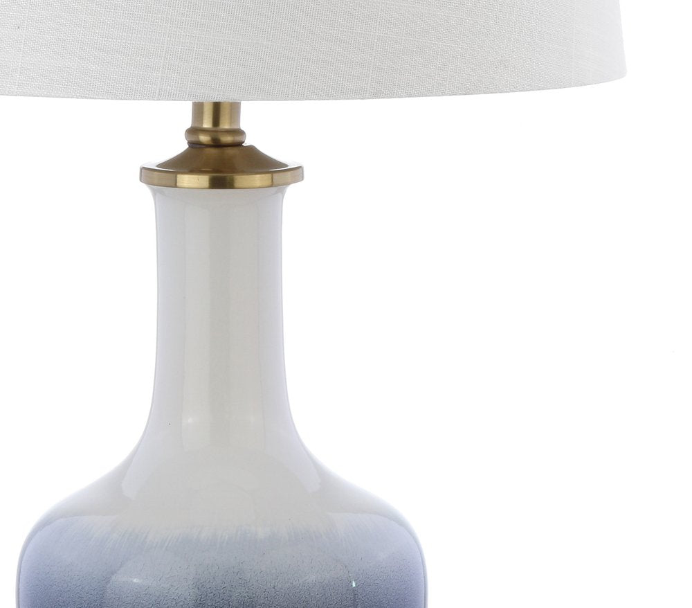 25" Gold Novelty Table Lamp With Drum Shade. Table lamp isolated on a plain white background.