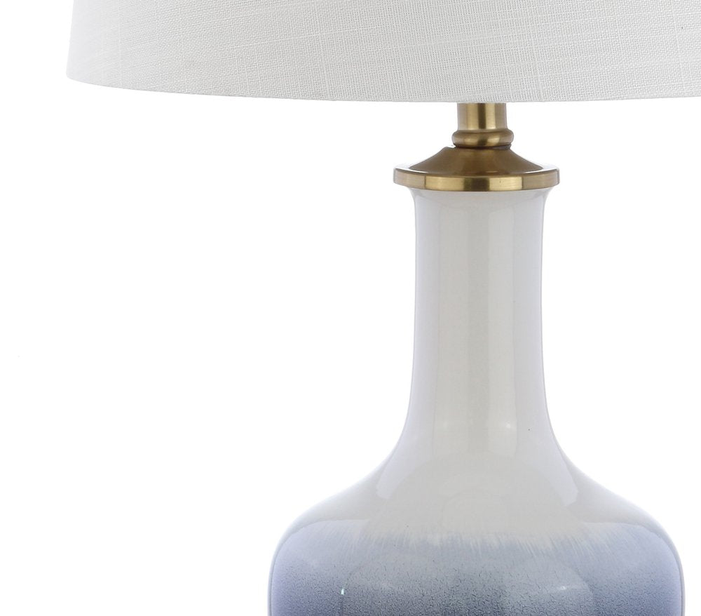 25" Gold Novelty Table Lamp With Drum Shade. Table lamp isolated on a plain white background.