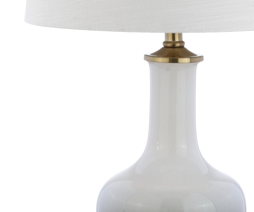 25" Gold Novelty Table Lamp With Drum Shade. Table lamp isolated on a plain white background.