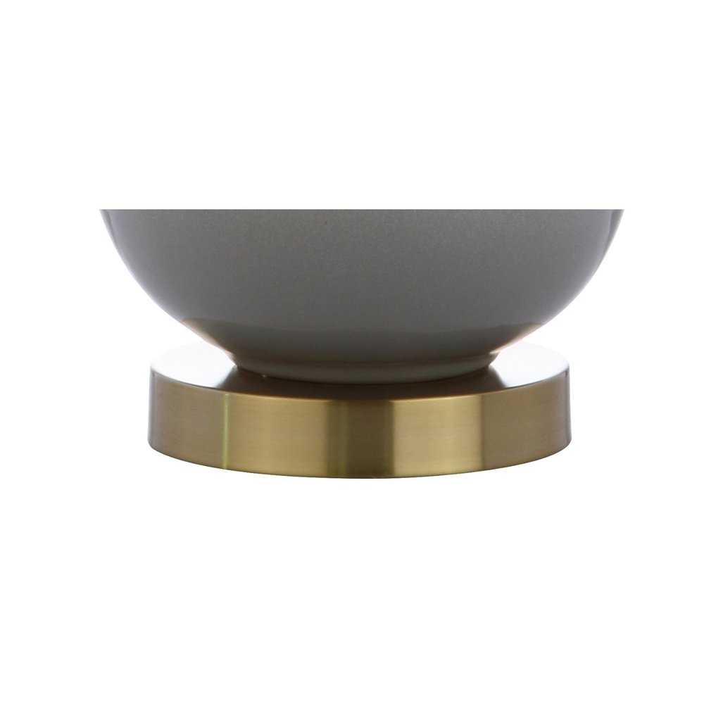 25" Gold Novelty Table Lamp With Drum Shade. Table lamp isolated on a plain white background, showing its gold color.