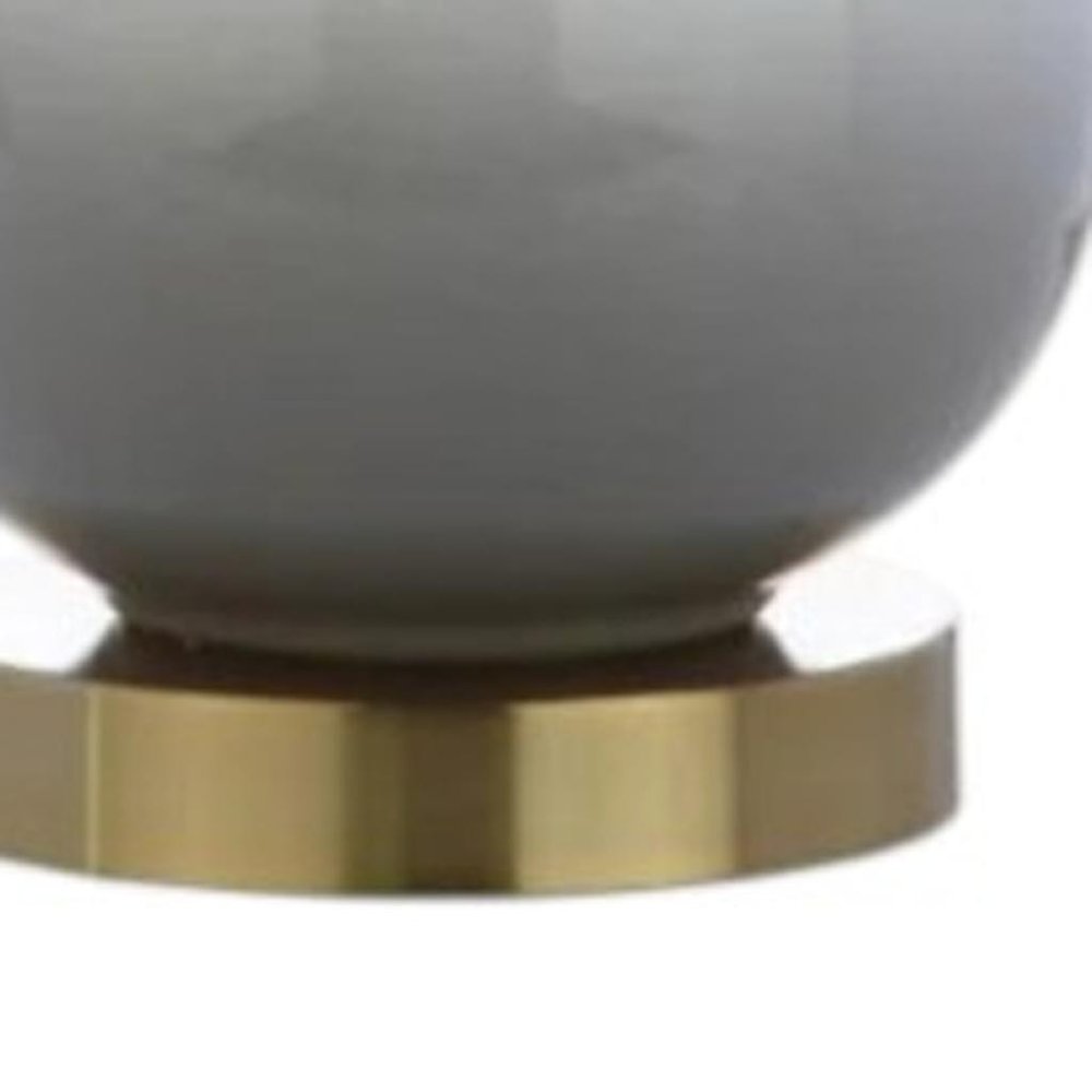 25" Gold Novelty Table Lamp With Drum Shade. Table lamp in gold.