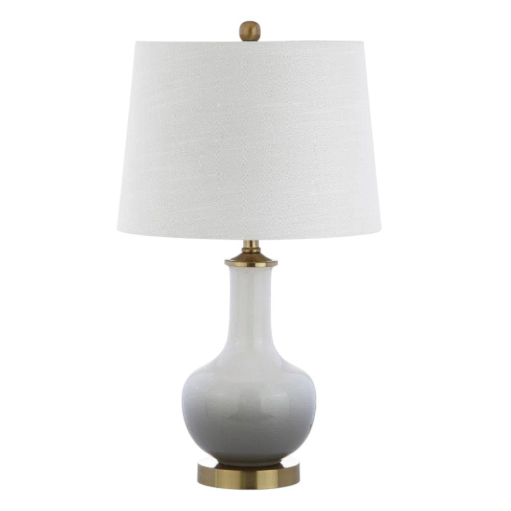 25" Gold Novelty Table Lamp With Drum Shade. Table lamp isolated on a plain white background.
