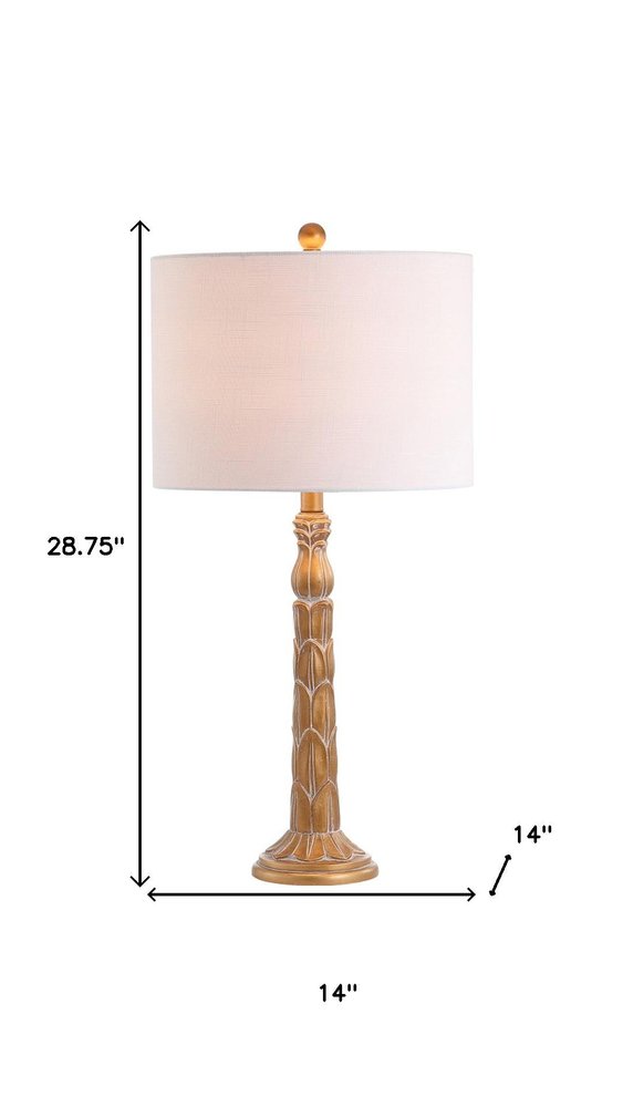 29" Antiqued Gold Table Lamp With Drum Shade. Table lamp isolated on a plain white background, in a gold finish.