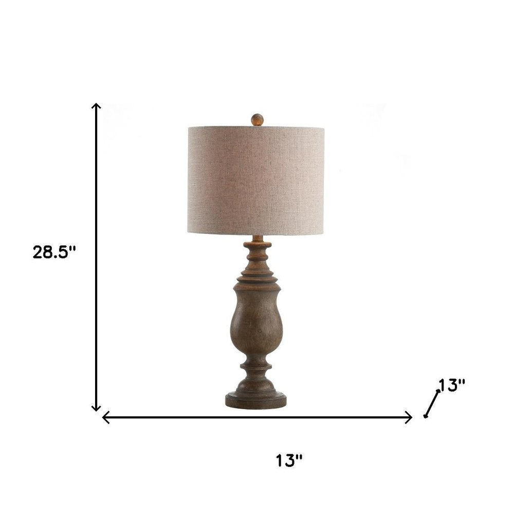 29" Brown Novelty Table Lamp With Globe Shade. Table lamp isolated on a plain white background, finished in brown.