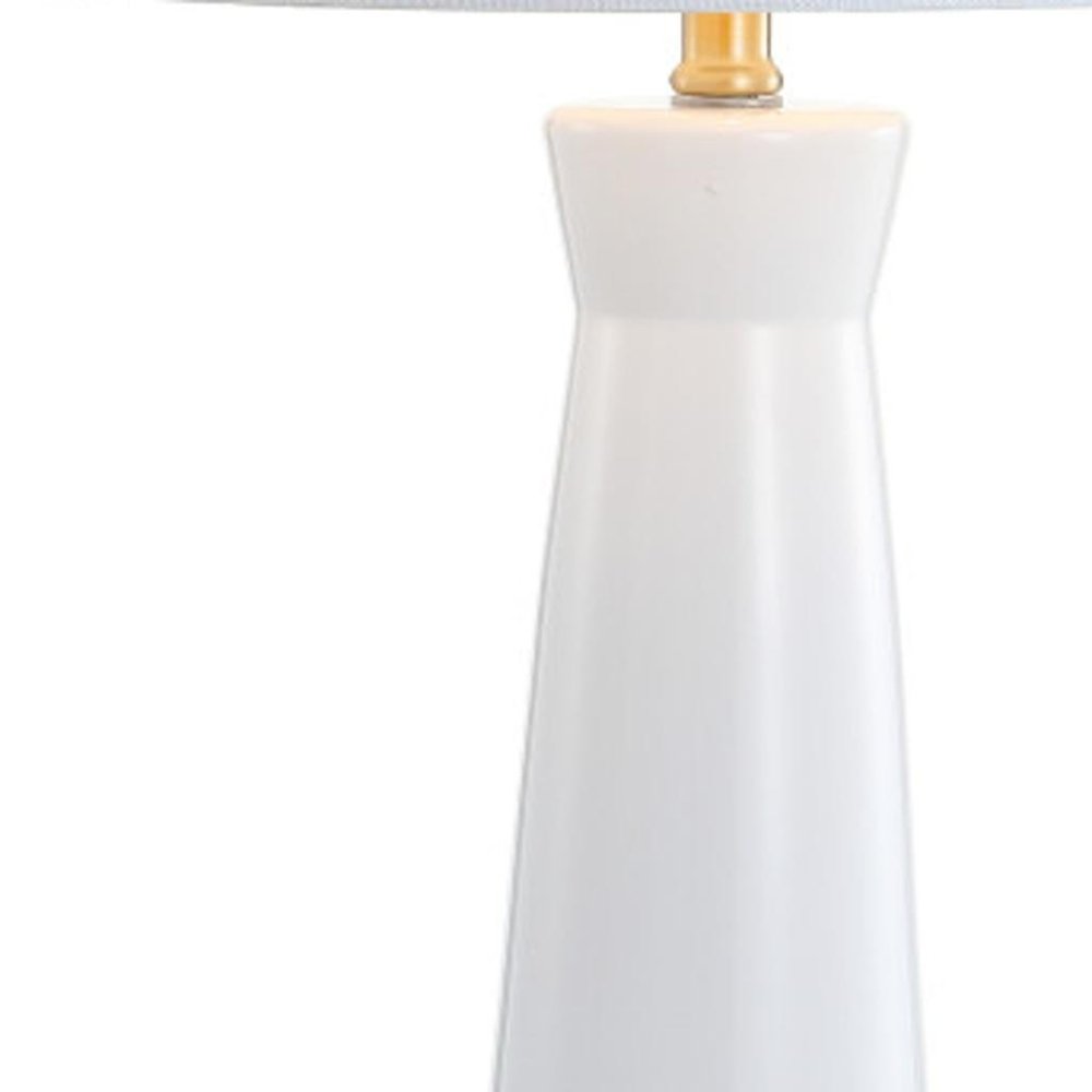 29" Gold Novelty Table Lamp With Globe Shade. Table lamp isolated on a plain white background, finished in gold.