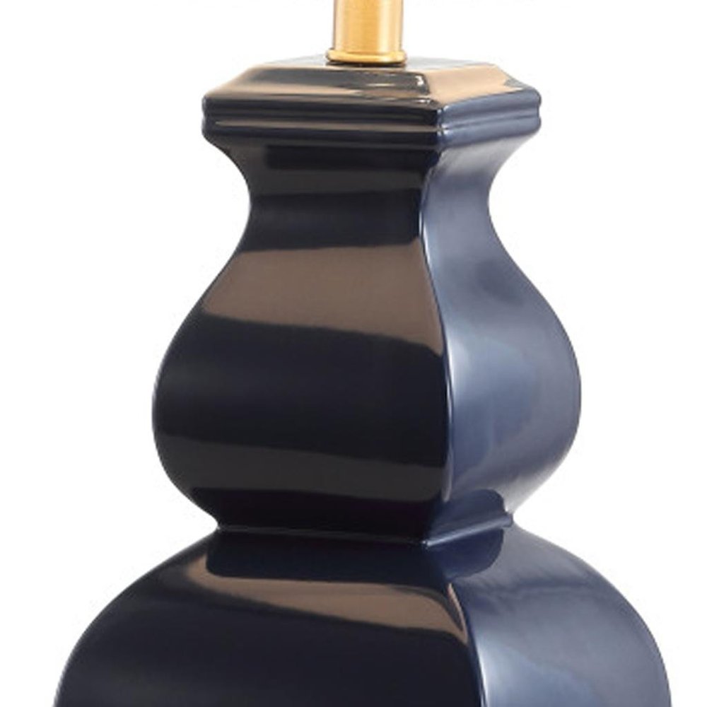26" Gold Novelty Table Lamp With Globe Shade. Table lamp isolated on a plain white background.