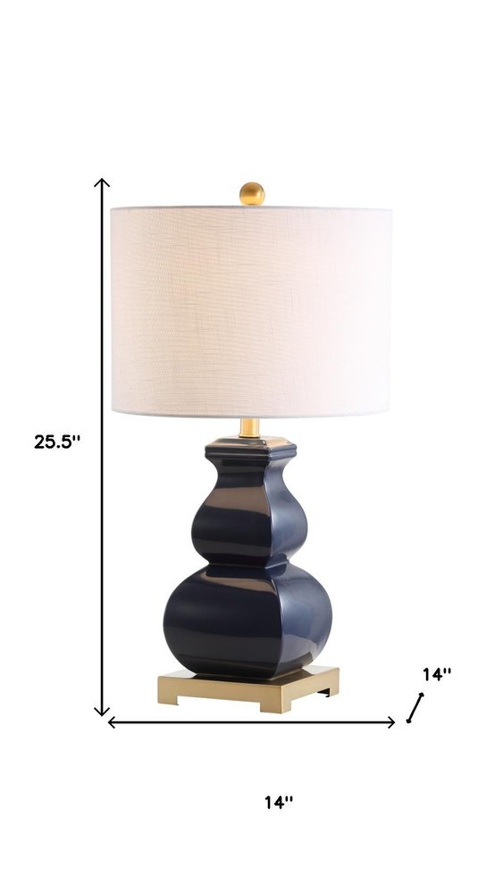 26" Gold Novelty Table Lamp With Globe Shade. Table lamp isolated on a plain white background.
