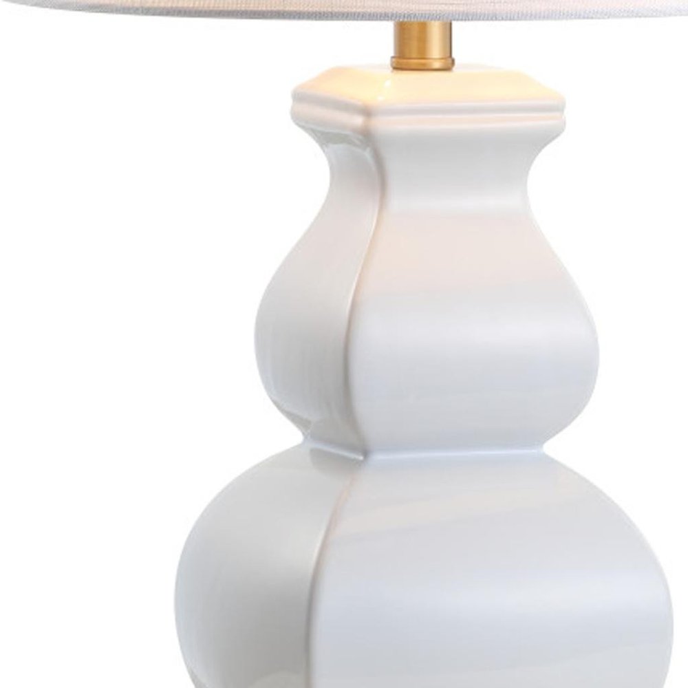 26" Gold Novelty Table Lamp With Globe Shade. Table lamp isolated on a plain white background.