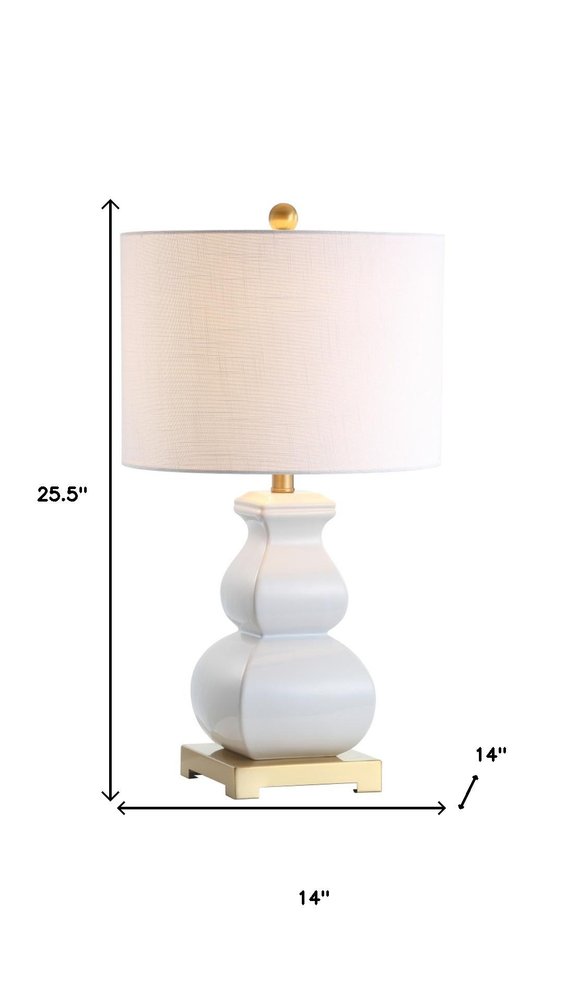 26" Gold Novelty Table Lamp With Globe Shade. Table lamp isolated on a plain white background.