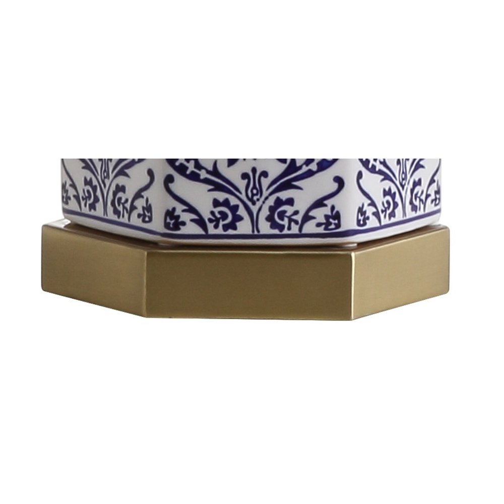 24" Navy Blue Gold And White Table Lamp With Drum Shade. Table lamp isolated on a plain white background, finished in gold.